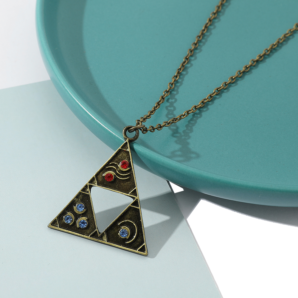 La légende du collier bouclier hylian oeil de Sheikah masque de Majora épée triforce symbole pendentif Zelda larmes du royaume