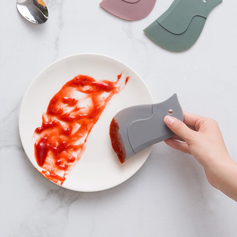 Dessin animé pingouin en forme de raclette racloir cuisine spatule plaque verre essuie-glace raclage huile cuisson ménage nettoyage outils