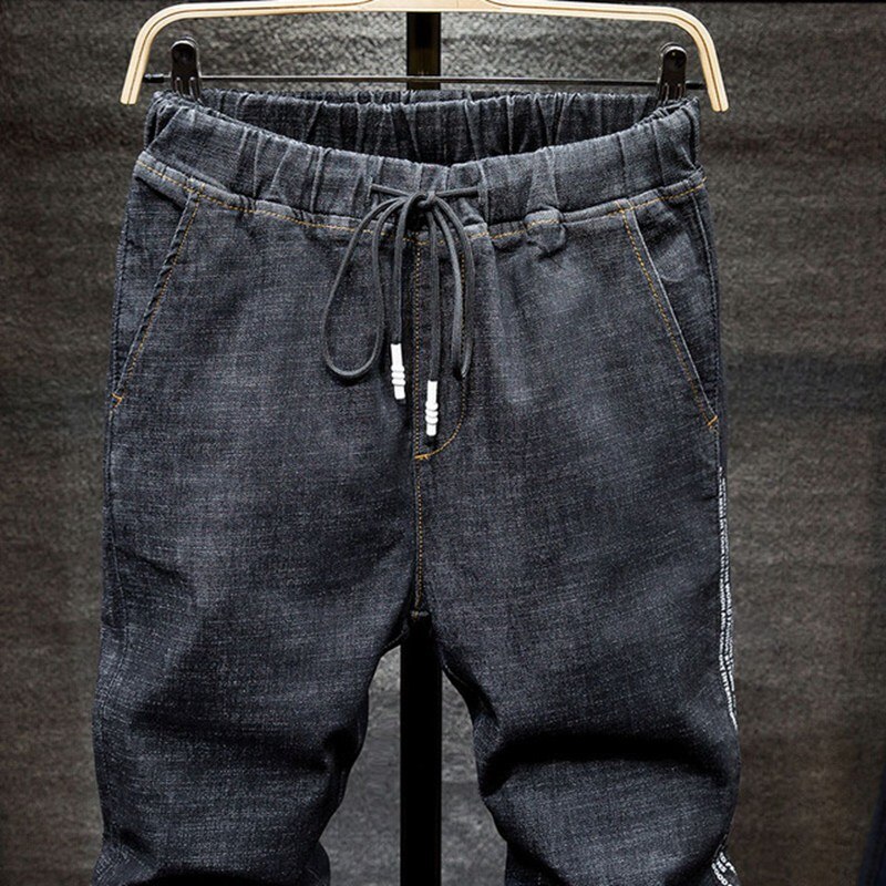 Salopette en jean homme personnalité masculine noir denim étudiant sarouel élastique stretch pieds minces pantalon Super grande taille 7XL 6XL