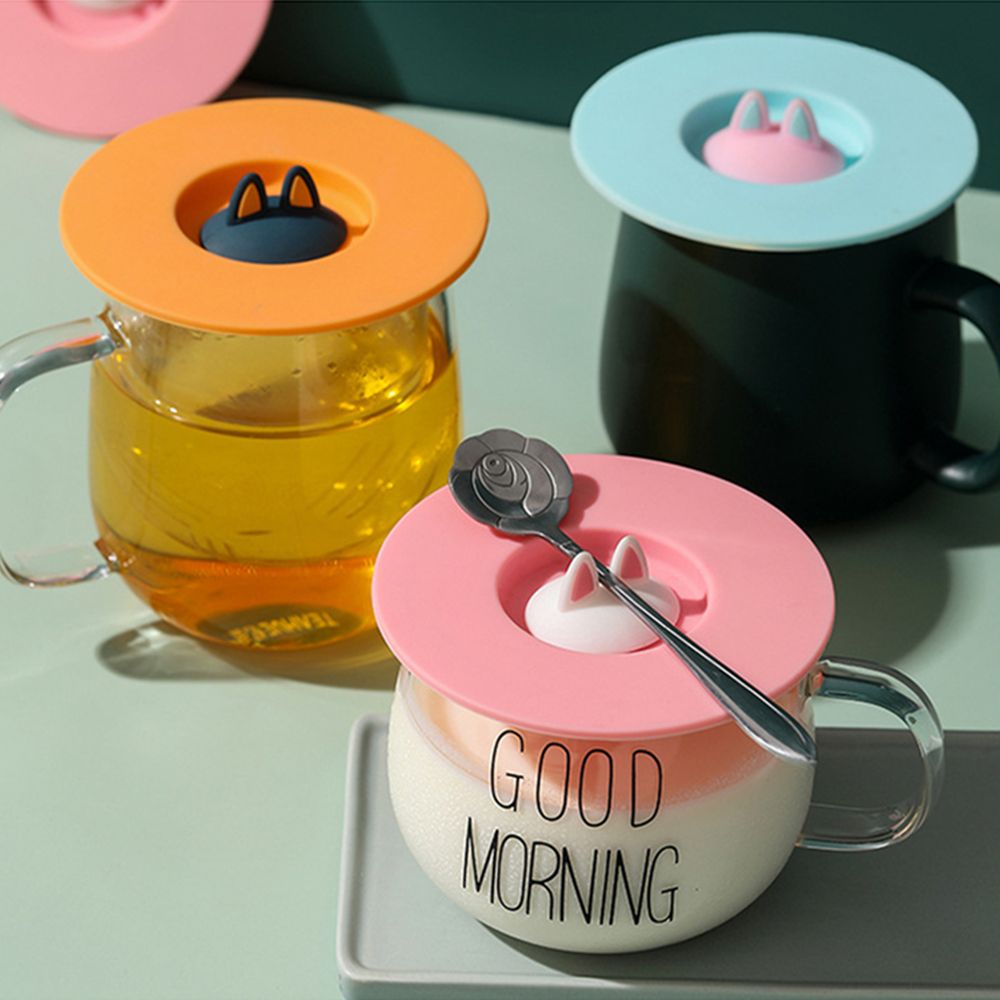 Durable, non-toxic, reusable coffee mug with sealed cover and anti-scalding suction cup lid.