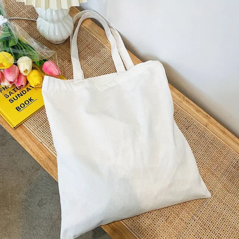 Einfache und lässige einfarbige Segeltuch-Material-Handheld-Umhängetasche für Damen mit großer Kapazität zum Einkaufen und Reisen
