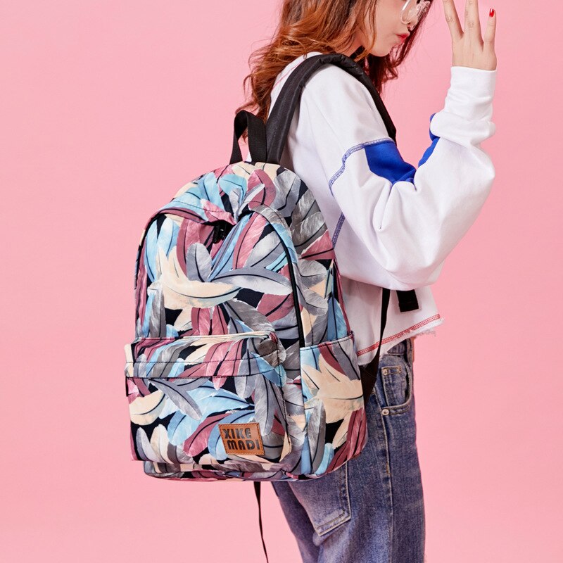 Xikemadi marca feminina mochila design pena impressão juventude anti-roubo viagem packbag meninas estudante sacos de escola feminino bagpack
