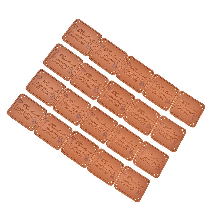 20 stk retro brun pu læder etiket håndlavet diy læder tags præget beklædningsetiketter: Nøgle