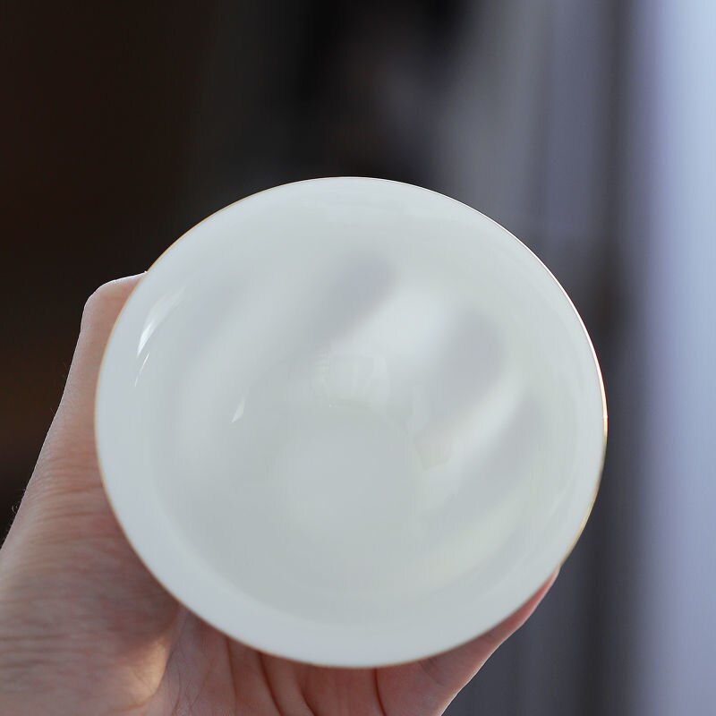 Tueen-cuenco de té de Jade, Taza de cerámica grande con contorno de porcelana blanca en dorado, para infusiones, Kung Fu
