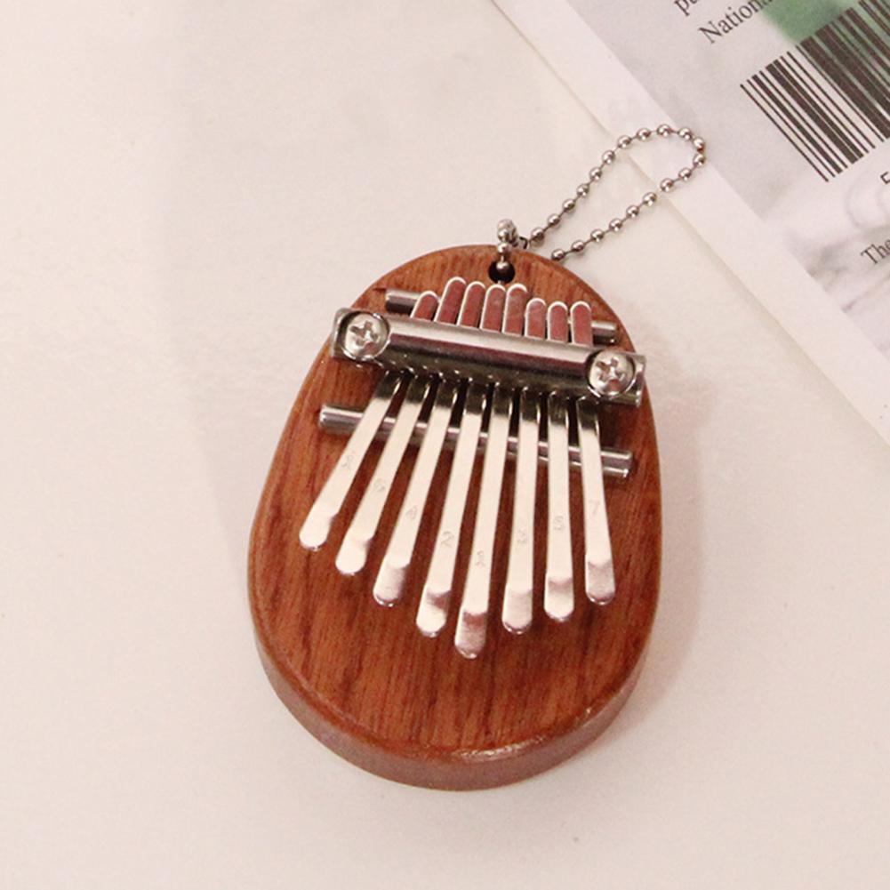 8-Tone Mini Portable Thumb Piano Wooden Small Finger Musical Instrument