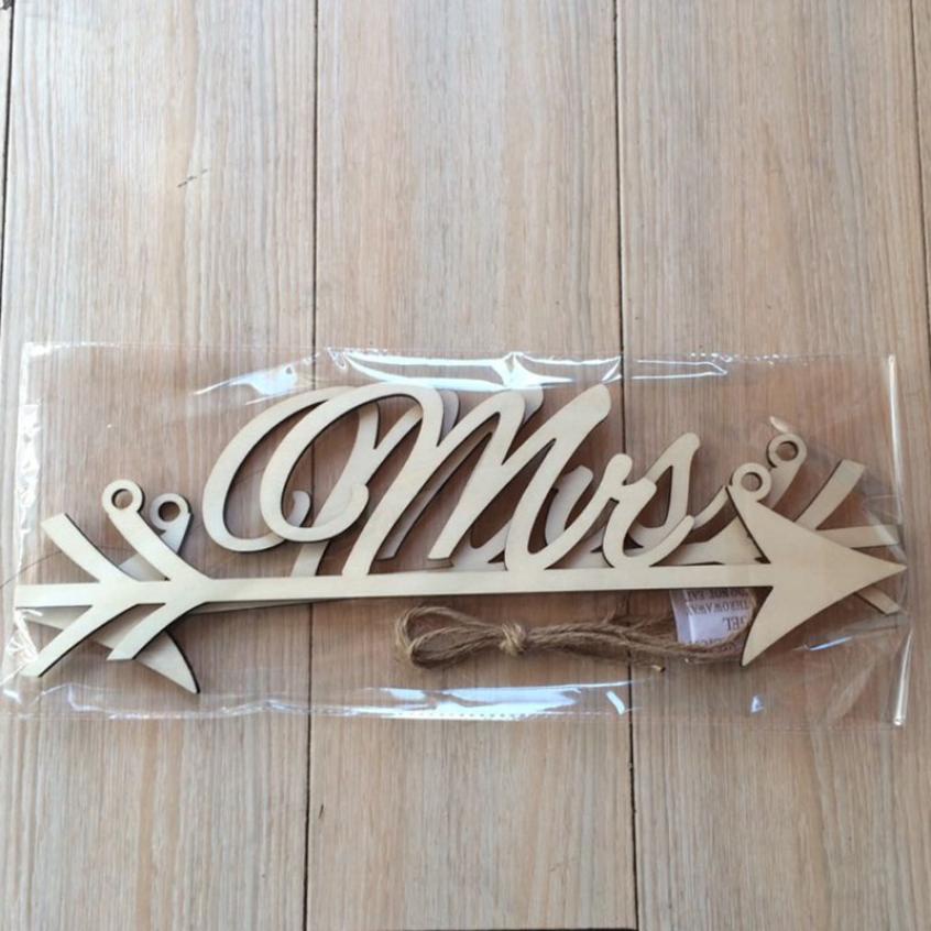 home decor wedding sign in wooden wedding letters and arrow signs indicating wedding party signage for clients