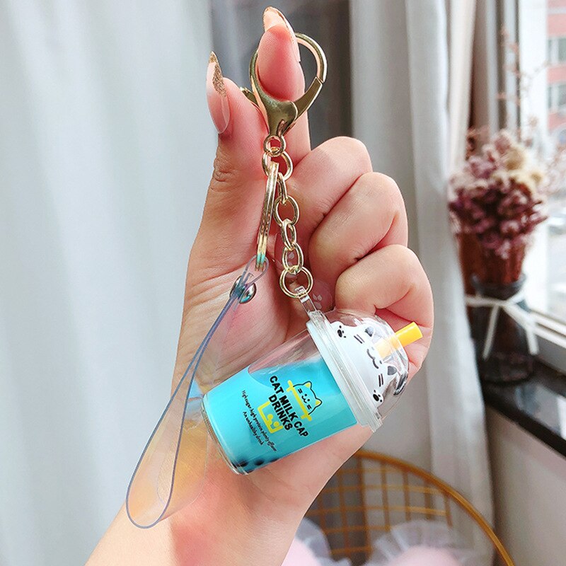 Neue Karikatur Nette Katze Auto Keychain Kreative Milch Tee Tasse Flüssigkeit Kristall Treibsand Pailletten Schlüssel Ring Tasche Anhänger für Frauen tasche Schlüssel C: Blau