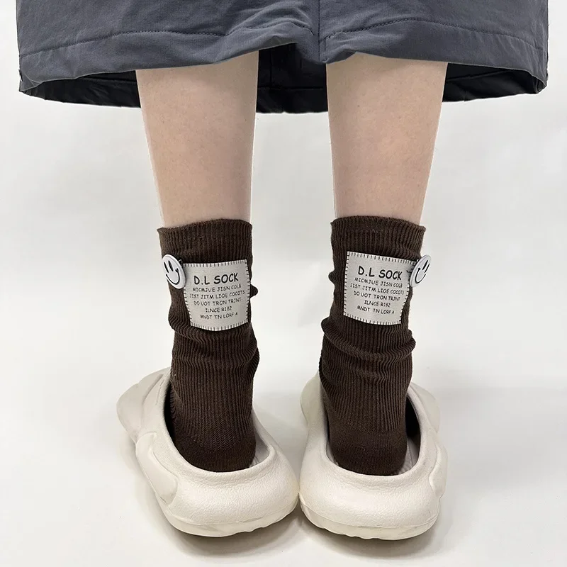 Kvinnor vintage bomull medelstora tubstrumpor tyg etikett brev tjock nål vinter varm japansk enfärgad casual sport parstrumpor