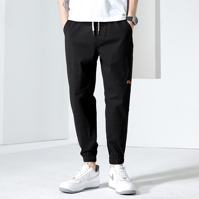 Moda Off White Casual Harem Pants męskie spodnie do biegania męskie Slim japońska moda uliczna kieszonkowe aplikacje Casual spodnie Harajuku