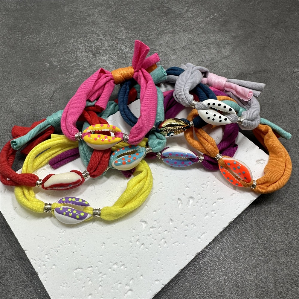 Bracciale con ciondoli a conchiglia a pois Linea di cotone colorata Braccialetti con corde intrecciate fatte a mano per gioielli da donna, uomo e bambino