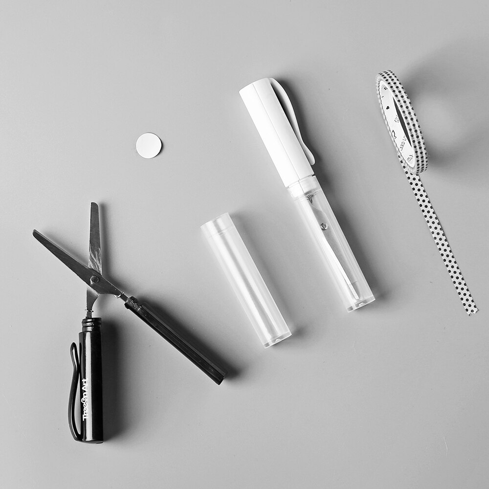 Stilige og enkle sakser i pennstil, elevene bærer bærbare minipenn-type håndkuttet kontorpapir