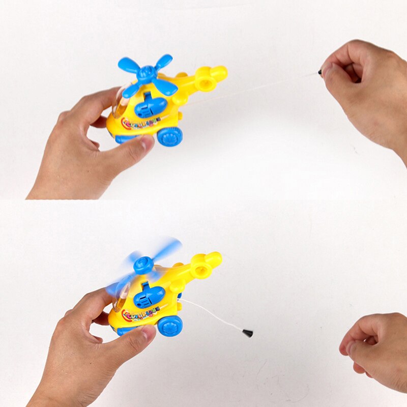 Ehbqna 1pc tegneserie plastik helikopter urværk reb op legetøj klassisk sjovt legetøj til børn tilfældig farve