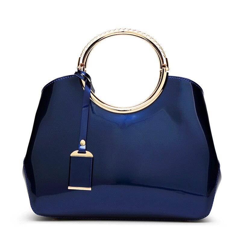 Saco de concha das mulheres 2019 nova moda europeia e americana couro patente um ombro saco do mensageiro textura rosto brilhante bolsa