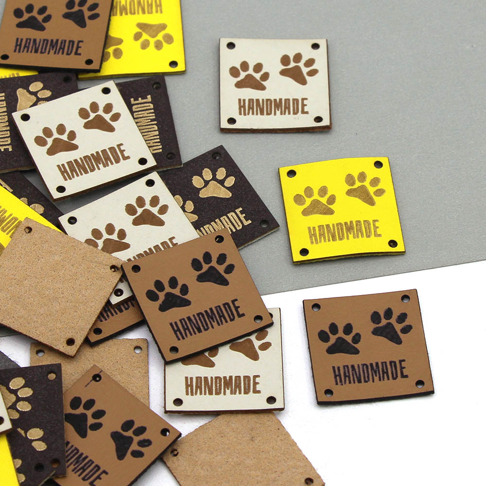 Etiquetas de cuero con huellas de animales, etiquetas hechas a mano para ropa, perro, gato, oso, pata, etiqueta hecha a mano para coser sombreros DIY, 20 piezas, 25x25mm