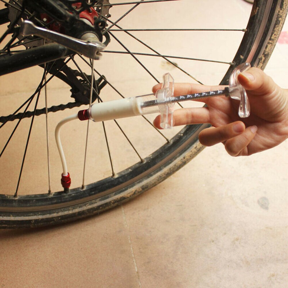 Mountain road cykler fugemasseindsprøjtning, der anvendes til slangeløst dækreparationsvæskefyldning af cykeltilbehør