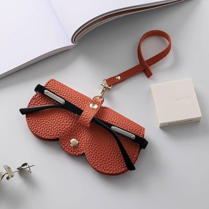 Brillenhülle mit Litschi-Prägung, niedlich, zum Aufhängen, PU-Leder, Sonnenbrille, Lesebrille, Aufbewahrungstasche, tragbarer Reise-Brillenhalter: Orange