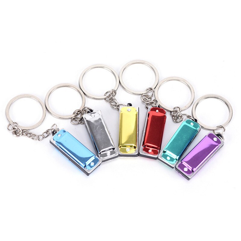 1 pc mundharmonika legetøj nøglering mundorgel nøglering vedhængende rad sølvfarve tilfældig 4.2*1.4*1.1 cm