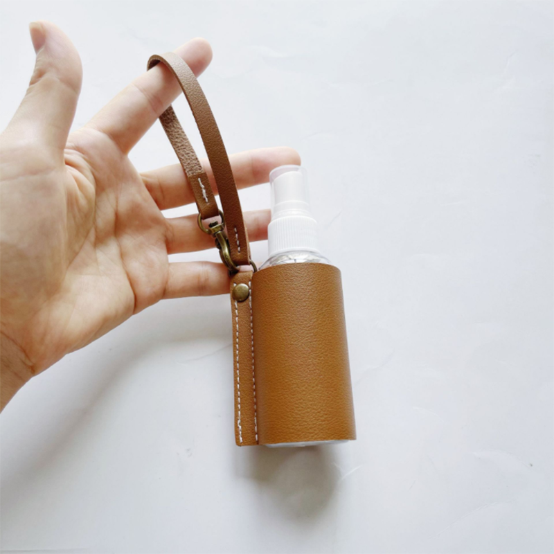 LLavero de Gel hidroalcohólico, funda desinfectante de manos, minibotella de Gel hidroalcohólico portátil, Funda de cuero, llavero de salud, 1 ud.