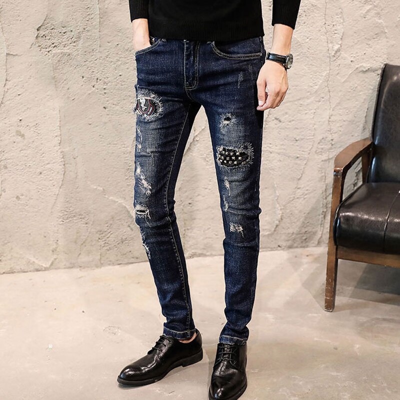 Pantalones vaqueros elásticos ajustados para hombre, Jeans rasgados desgastados negros con remaches, Jeans ajustados de Hip Hop para club nocturno