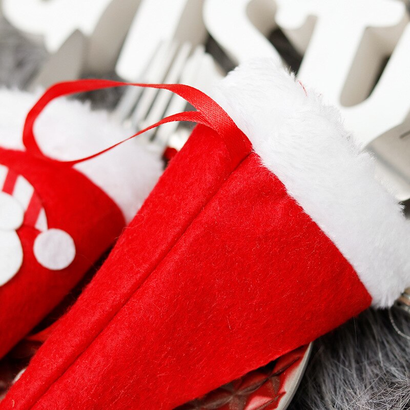 Kerstversiering kerstmuts dao cha tao mes en vork tas kersttafel feestdecoratie