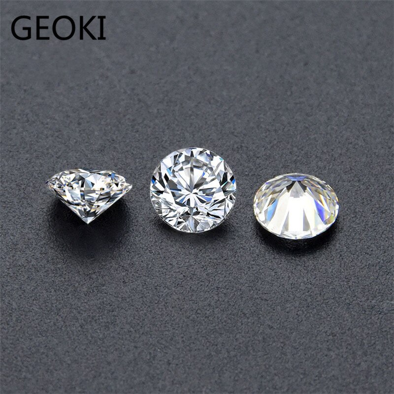 Geoki a passé le Test du diamant 1 Ct, perles rondes en Moissanite, couleur D, coupe parfaite, VVS1, pour la fabrication de bagues de mariage, bijoux pour femmes