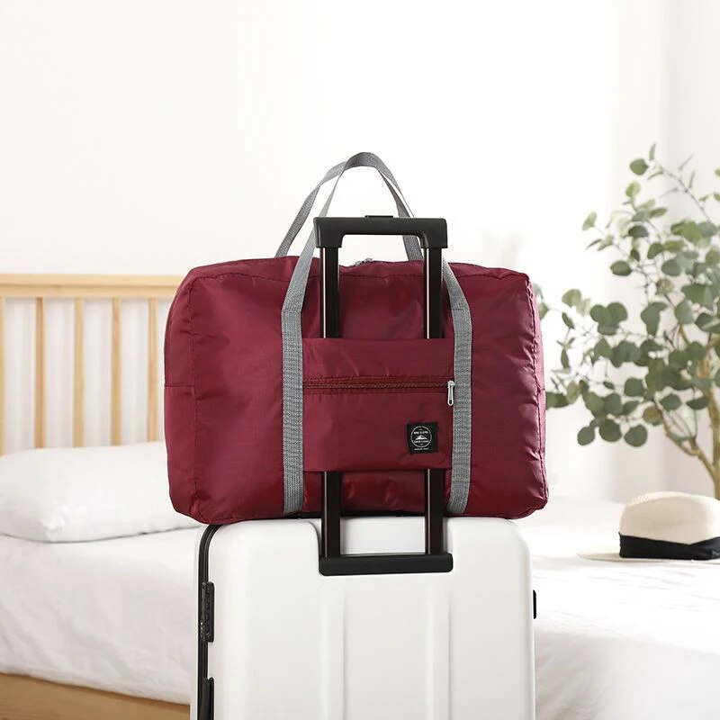 Modieuze opvouwbare reistas: spatwaterdichte handbagage met grote capaciteit voor unisex fitness- en vakantiereizen: Rood