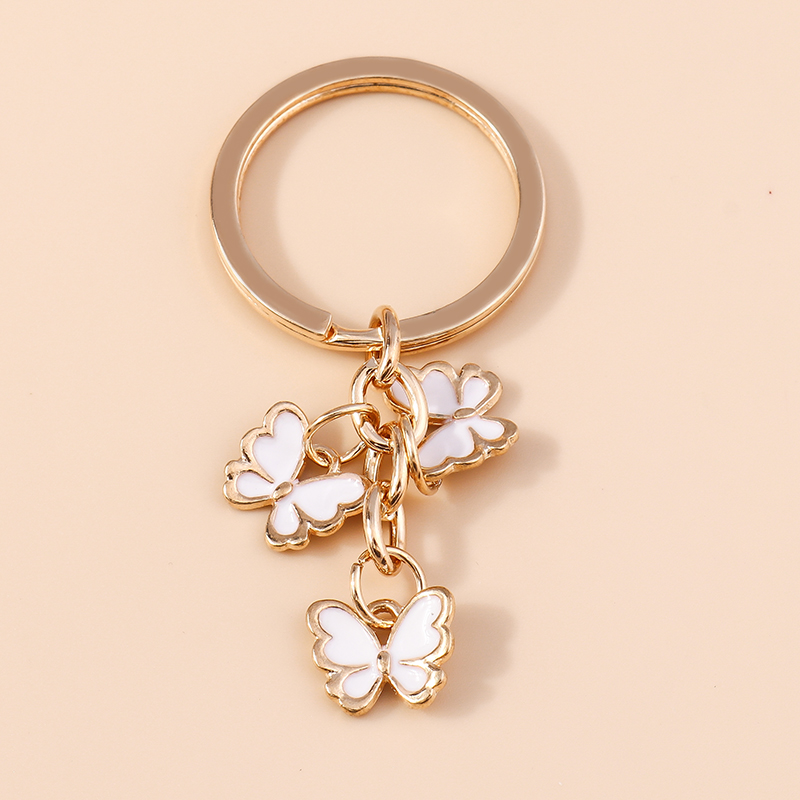 Portachiavi con libellule smaltate carine portachiavi con impronta di gatto portachiavi per auto per donna ciondoli per borsetta per ragazze regali di gioielli DIIY: champagne
