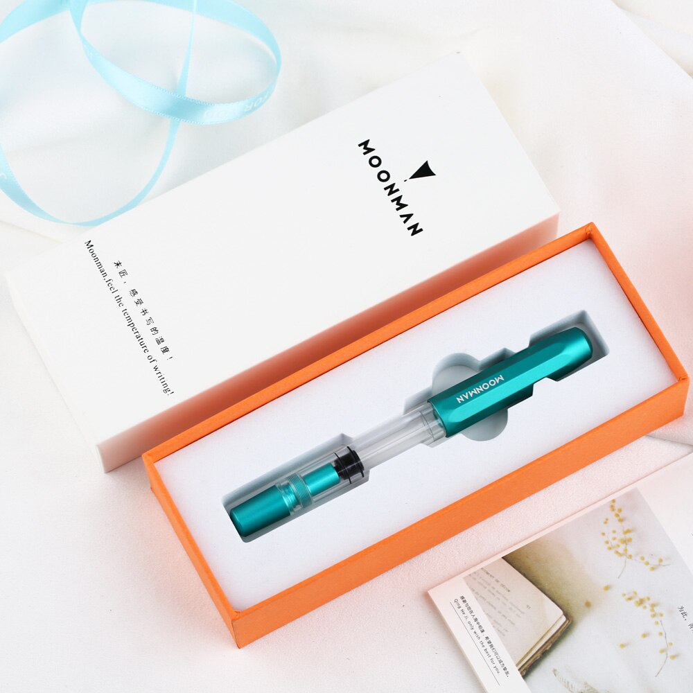 Pluma fuente de Metal Moonman T1 Piston de gran capacidad, pluma de tinta F Nib, caja Original