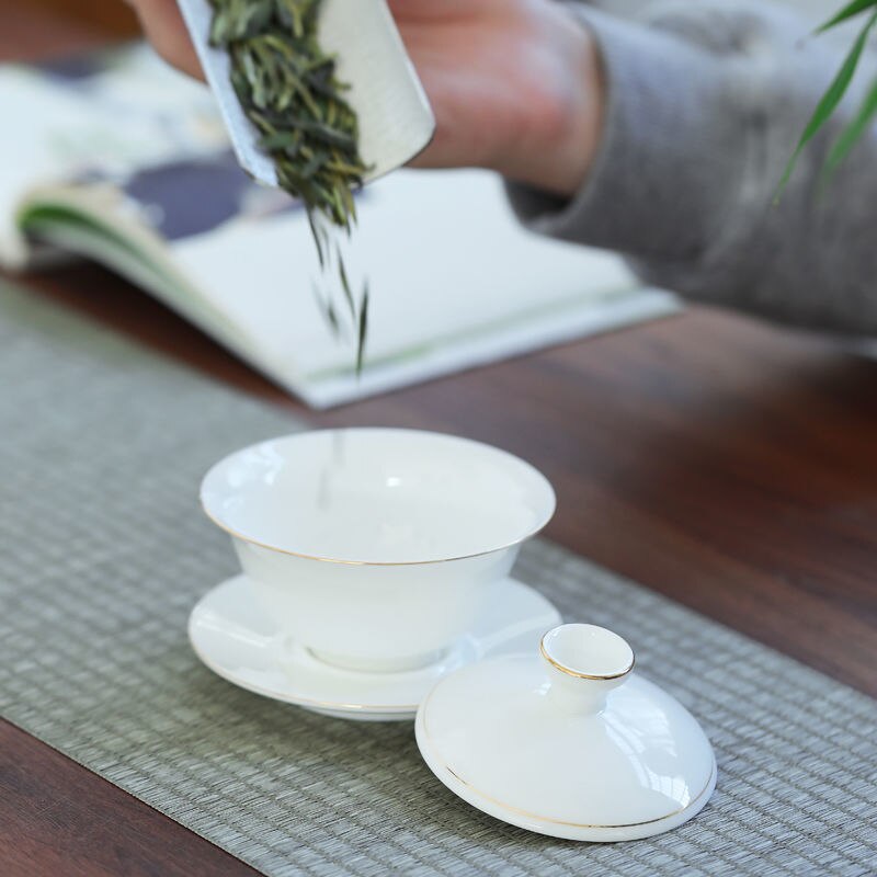 Tueen-cuenco de té de Jade, Taza de cerámica grande con contorno de porcelana blanca en dorado, para infusiones, Kung Fu