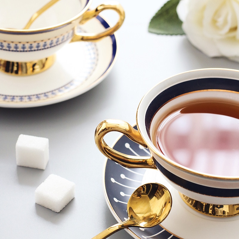 Tazas y platillos de porcelana blanca, juego de té Simple de cerámica, Tazas de café de moderno Para cafetería