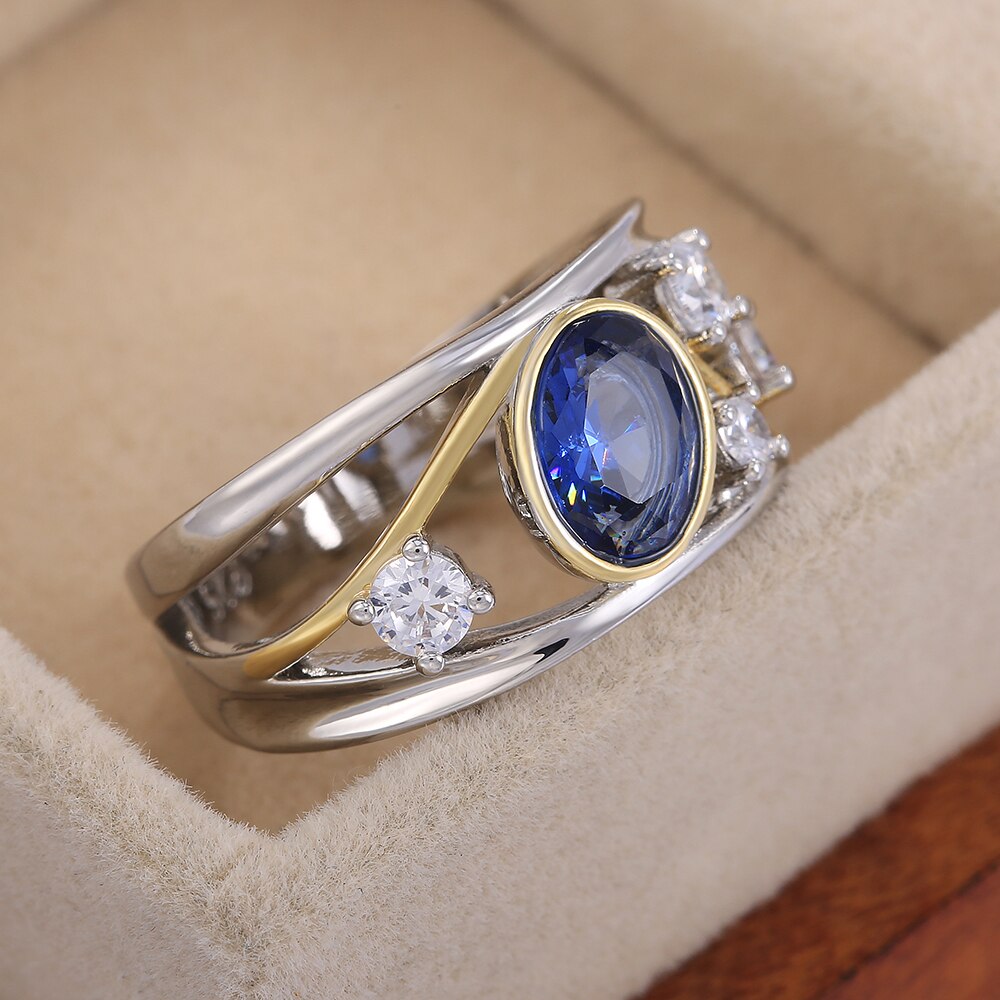 Huitan WunderschöNe Aushöhlen Frauen Finger Ring Oval Blau CZ Stein blendend Hochzeit Braut Ring Tanzen Party Zubehör