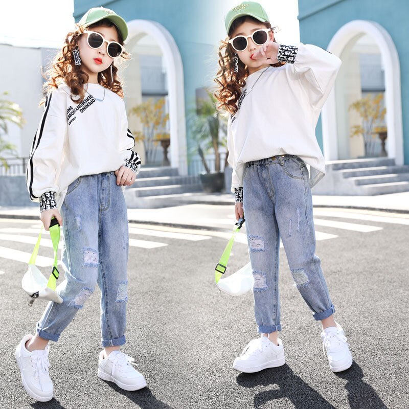2021 primavera nuovi Jeans tinta unita per bambini ragazza stile coreano stile estero buco moda All-match pantaloni Casual per bambini KJ14
