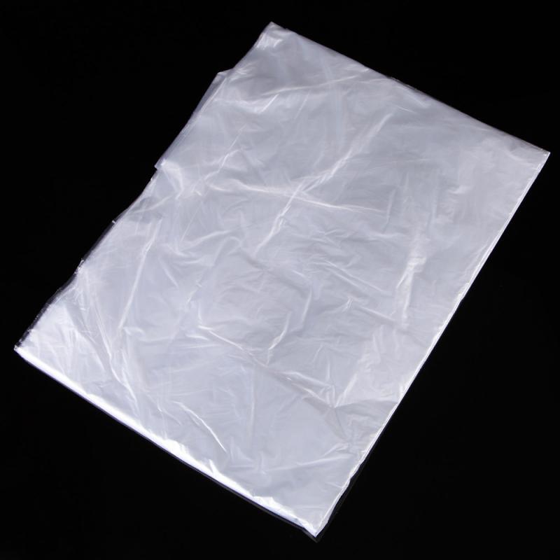 100/50 pcs jetable Cape Salon de coiffure tissu coupe de cheveux coiffure Cape Salon de coiffure Capas coiffeur tablier enveloppement