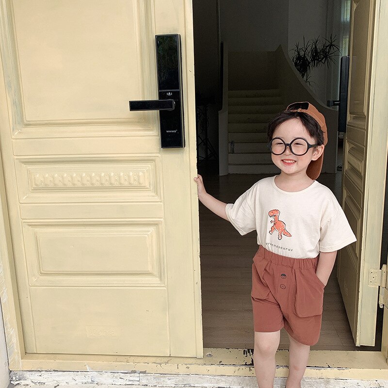 Dei ragazzi di proprietà carino dinosauro stampato morbido magliette dei bambini del cotone per Bambini graffiti Magliette 1-7Y