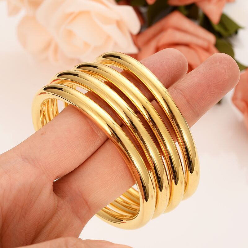 4- teiliges set aus dubai-glasur-armreifen, 24 k feine gold-gf-dubai-armbänder, afrikanisch-arabische artikel