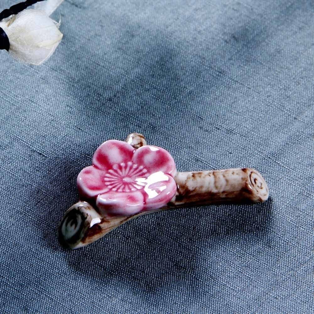 1 unidad de soporte para cuchillos y cuchara de porcelana con apoyo de flor de ciruelo y palillos, soporte de cerámica para decoración de fiestas y cenas
