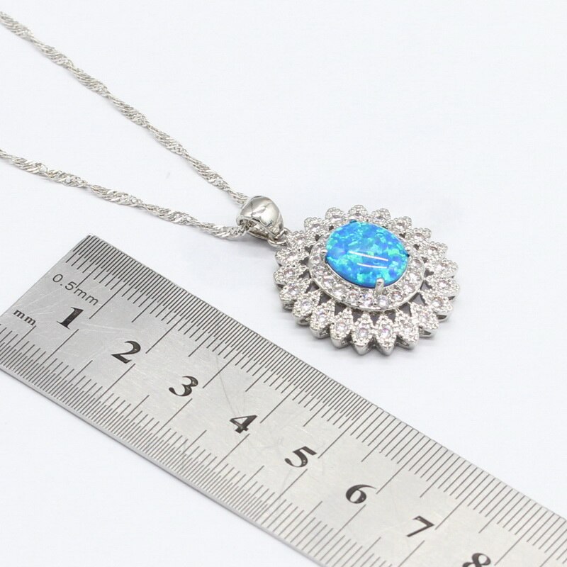 Zilveren sieradensets met blauwe opaal voor dames, kettinghangers, oorbellen en hemelsblauwe kristallen zirkonia armbanden