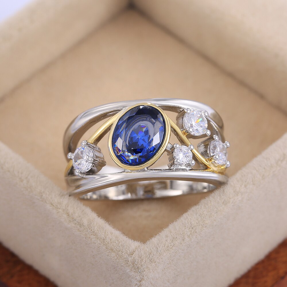 Huitan WunderschöNe Aushöhlen Frauen Finger Ring Oval Blau CZ Stein blendend Hochzeit Braut Ring Tanzen Party Zubehör