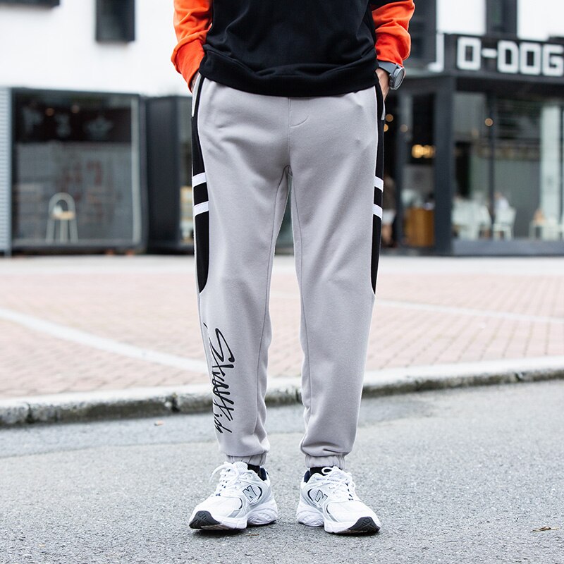 Streetwear løse mænd bukser udendørs sportsbukser ankel bundet mellem talje elastik mandlig hip-hop bogstav efterår lange bukser
