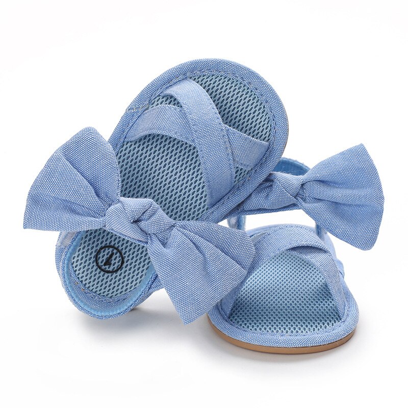 Scarpe da bambina per bambini sandali piatti per bambini sandali suola in gomma morbida Premium antiscivolo fiocco estivo punta d'onda pizzo scarpe da passeggio