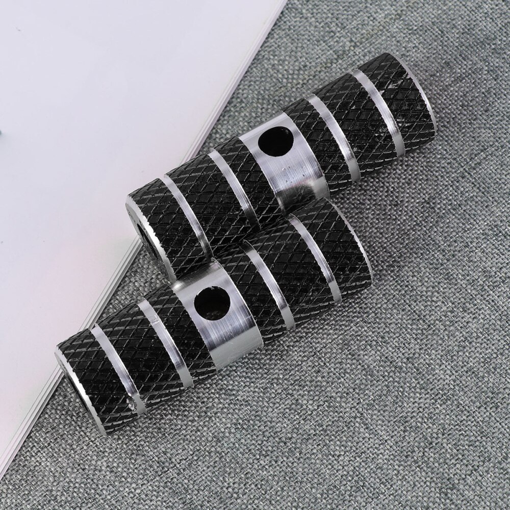 Een paar aluminiumlegering fiets cilinder stoel as stunt pegs voor mountainbike (zwart)